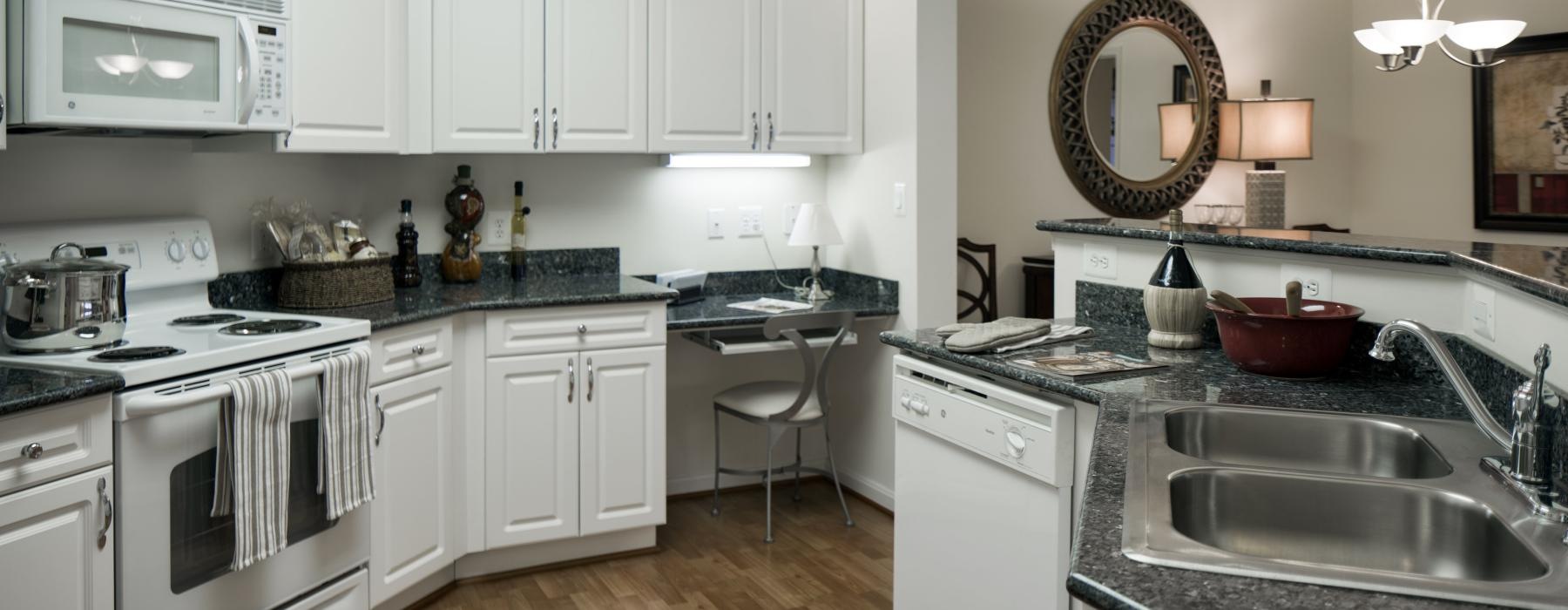 a kitchen with white cabinets