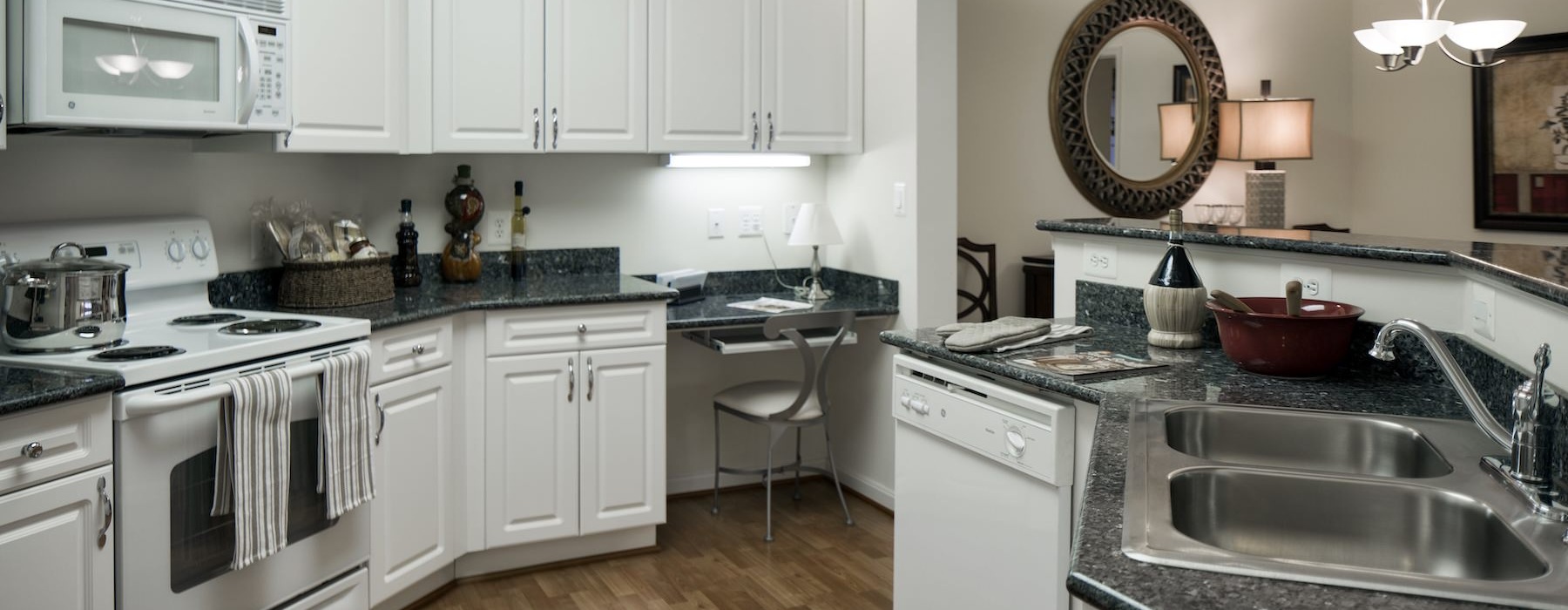 a kitchen with white cabinets