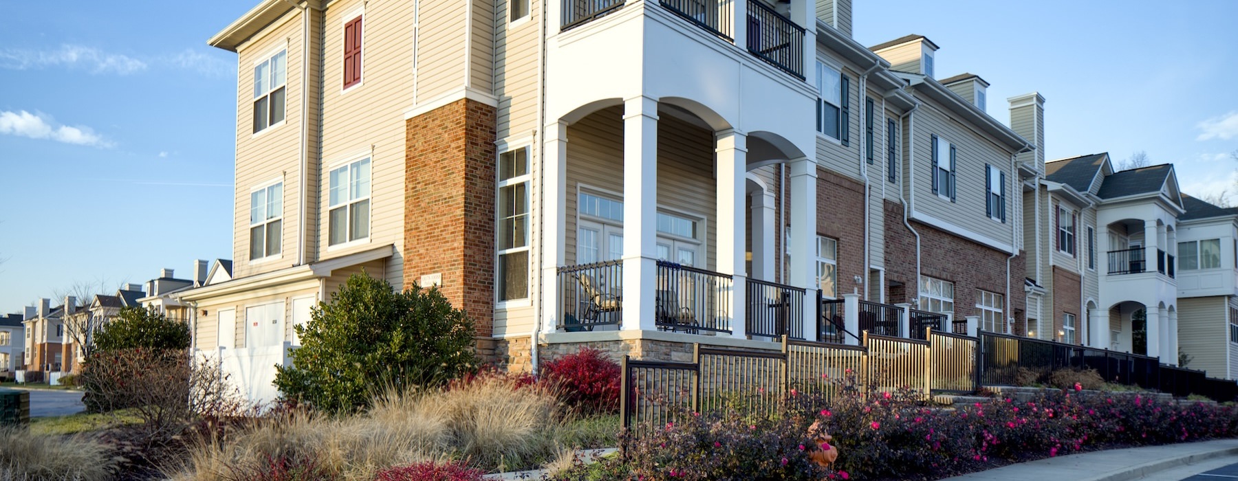 a large building with a landscaped garden in front of it