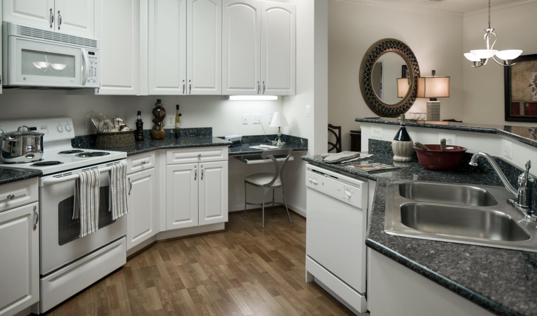 a kitchen with white cabinets